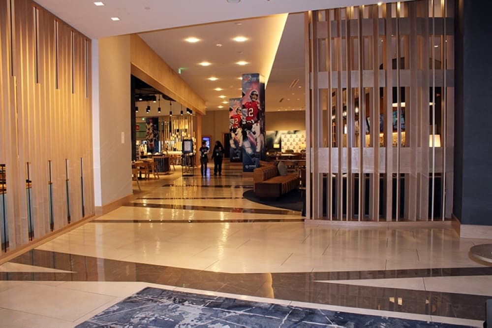 Entrance into a hotel with a partition half opened. 