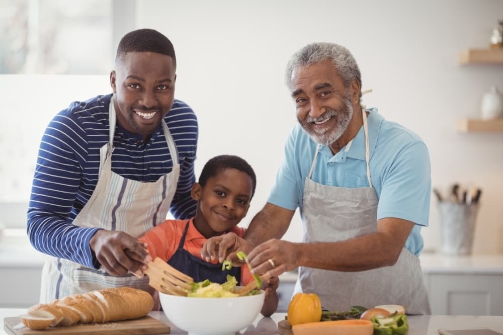 Family cooking dinner in kitchen