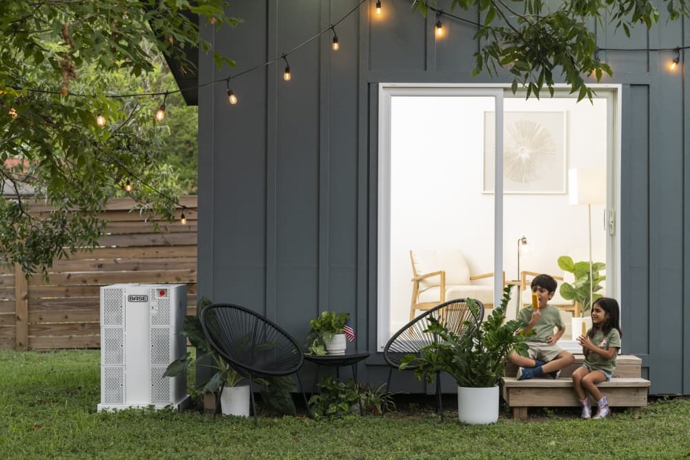 Base Power Company customers' kids sitting on porch