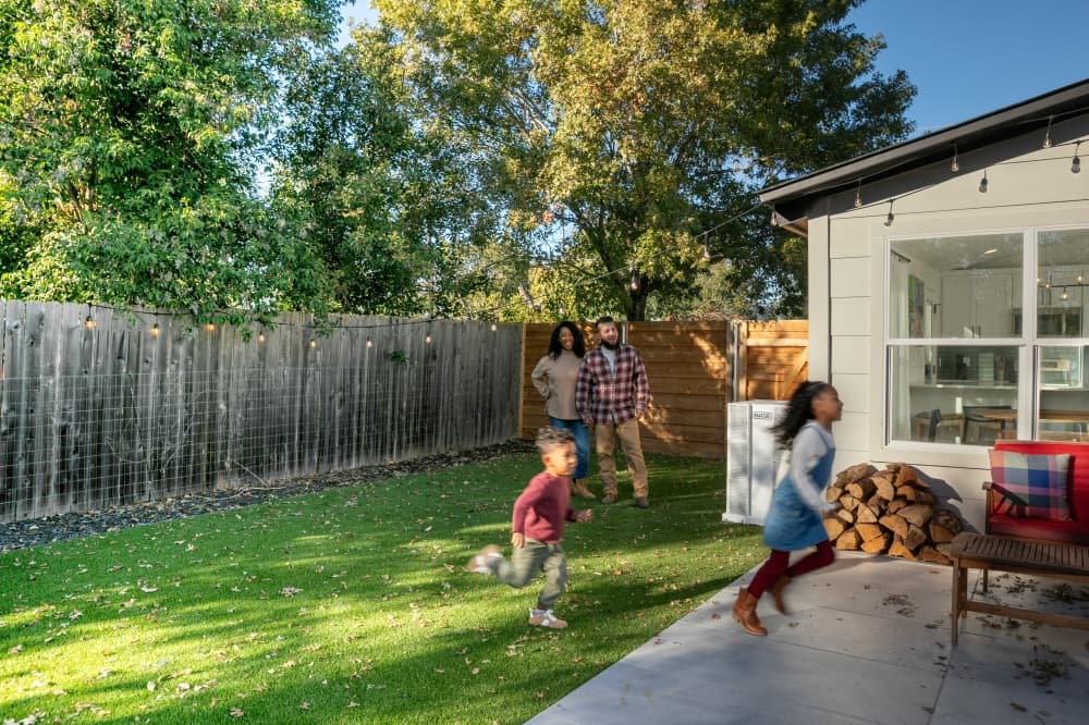 Base Power Company customers running in front yard