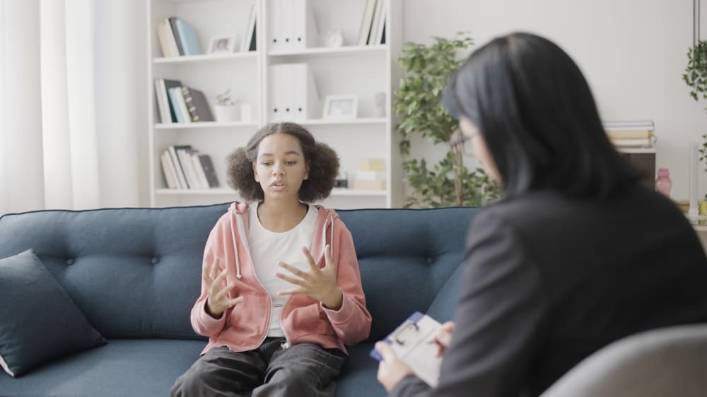 therapist talking to teenager