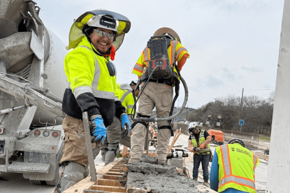Construction worker smiling on site