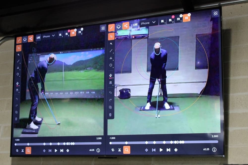 Digital monitor with images of a person golfing with AI directional lines showing motion. 
