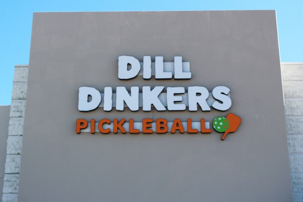 Exterior of a building featuring Dill Dinkers Pickleball signage. 