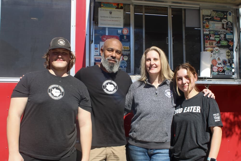 An image of the owners and two employees. 