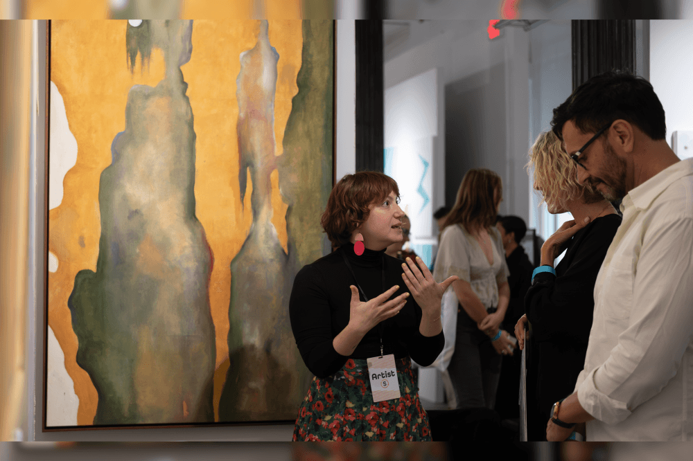The Superfair attendee speaking with artist