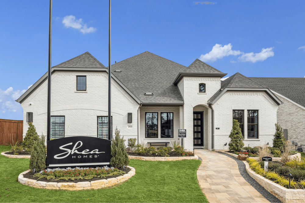 Modern Wildtree Magnolia home exterior with creek-side views, open green spaces, and architectural design by Shea Homes