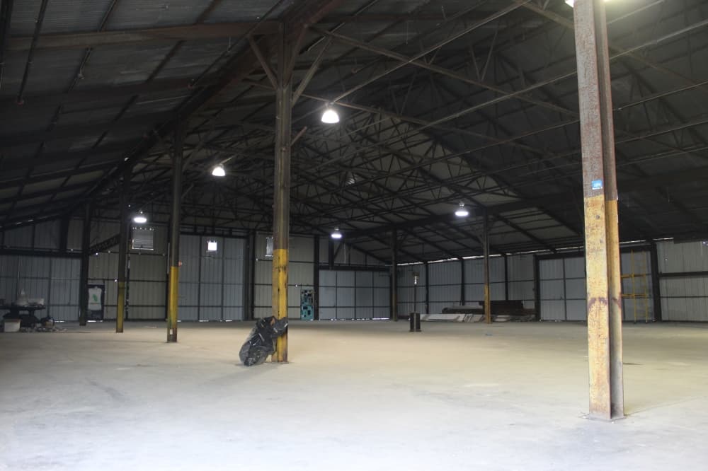 Image of vacant space at the McKinney Cotton Mill where the E3 McKinney Motor Club will open. 