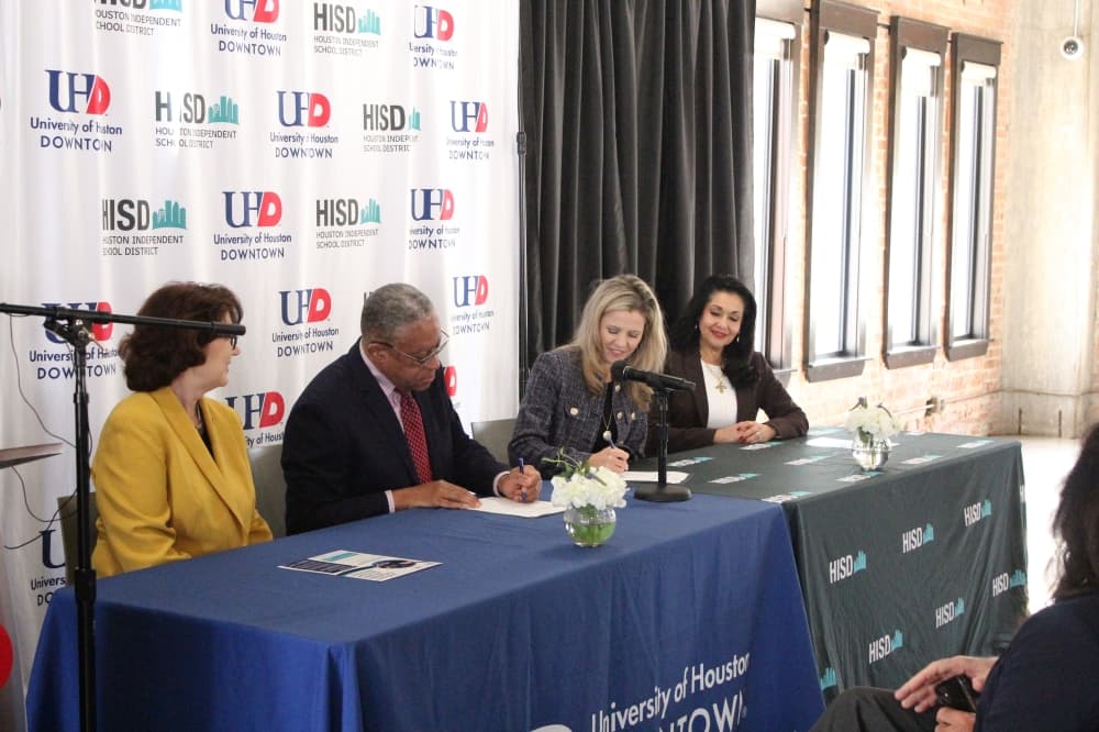 Houston ISD and University of Houston-Downtown signing documents for the new program at the press conferance