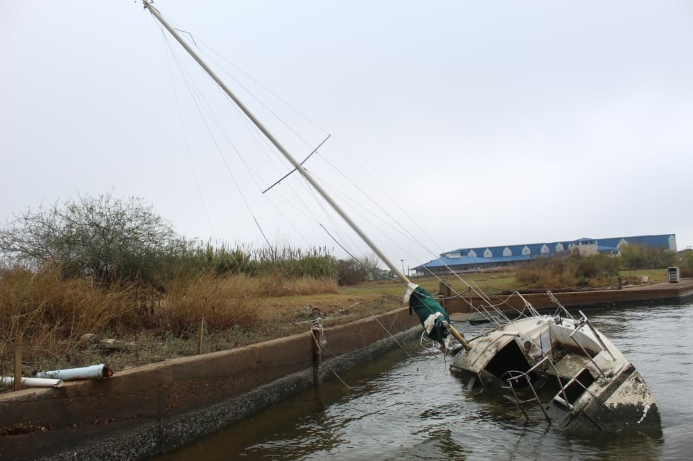 Sunken boats litter Clear Lake and bays