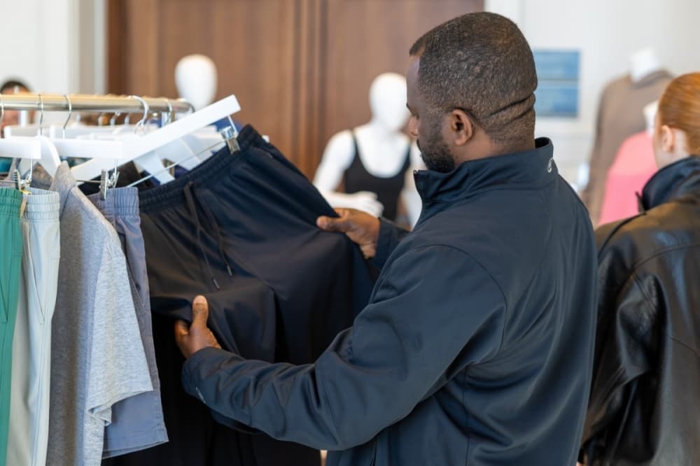 man looking at sweatpants