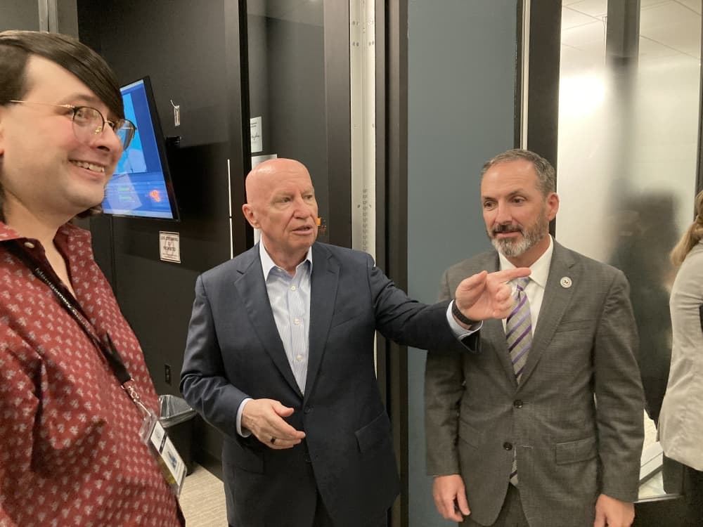 three men talking
