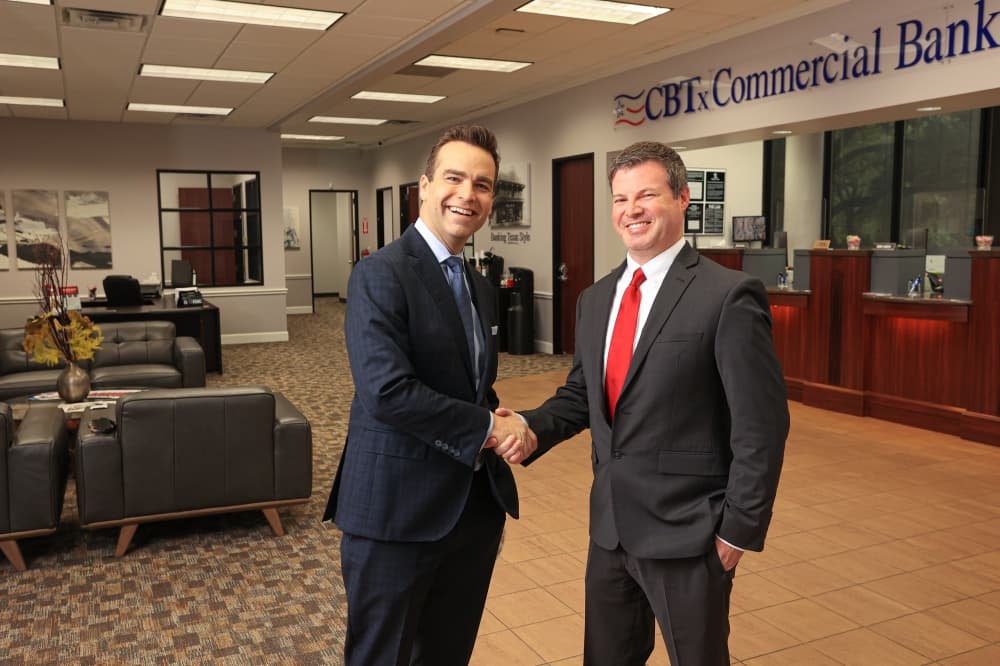 McKinney branch team members shaking hands