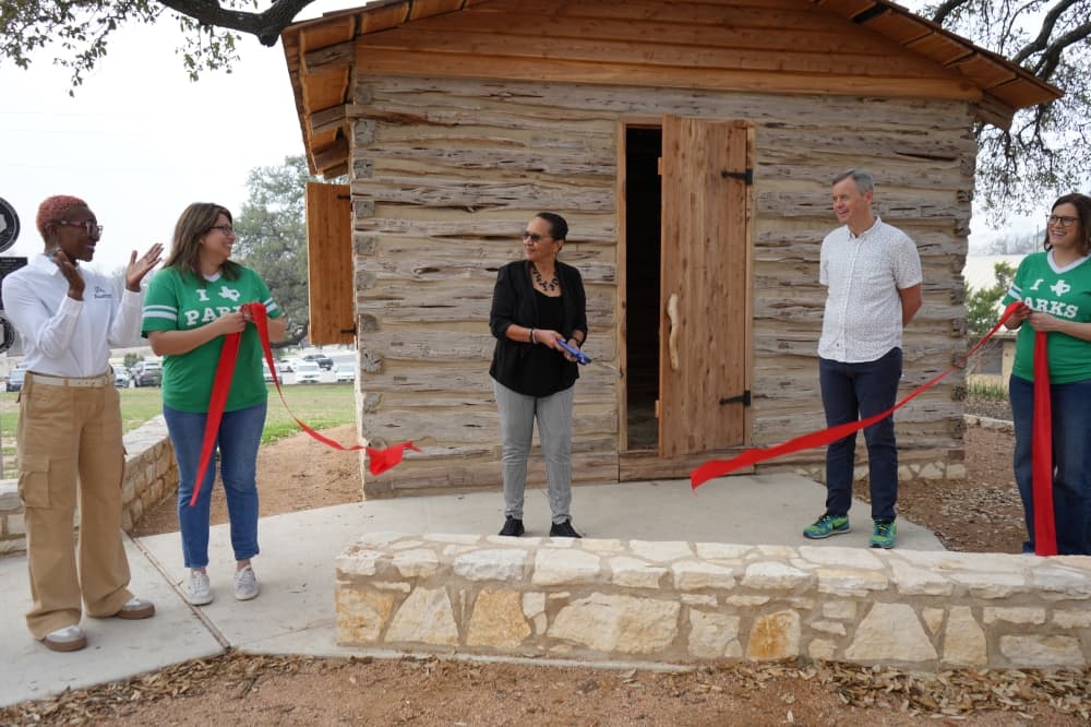 City marks restoration of landmark cabin home to Austin's first African American council member