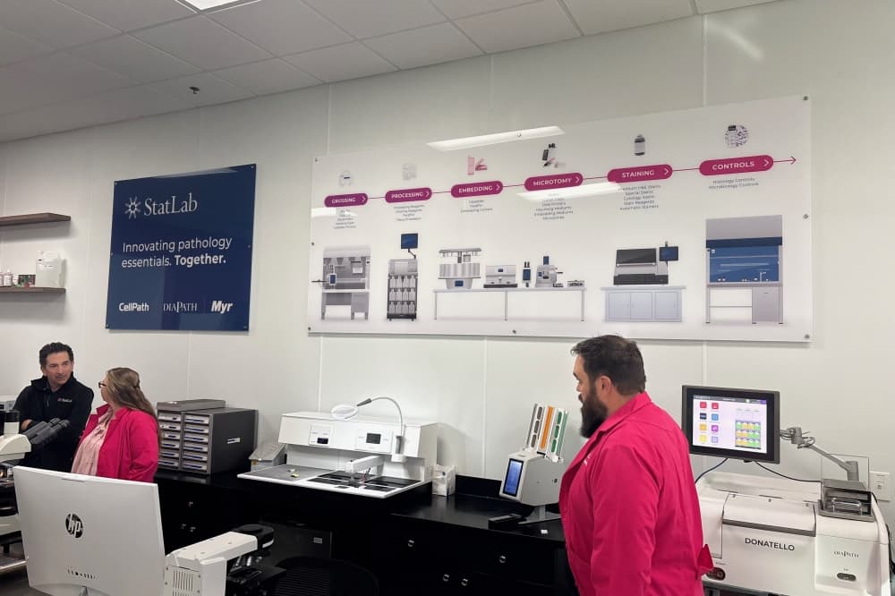 Image of the innovation lab with personnel walking around equipment. 