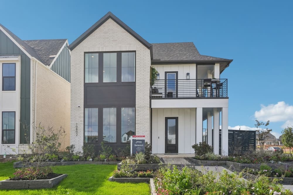 Family-friendly two-story Drees Custom Home at Austin Point in Fort Bend County with game room, media room and multi-generational suite floor plan