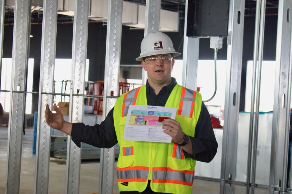 Mitchell McAnally, regional aviation leader for Garver, speaks during a Feb. 26 tour of the McKinney National Airport's future commercial service terminal. 