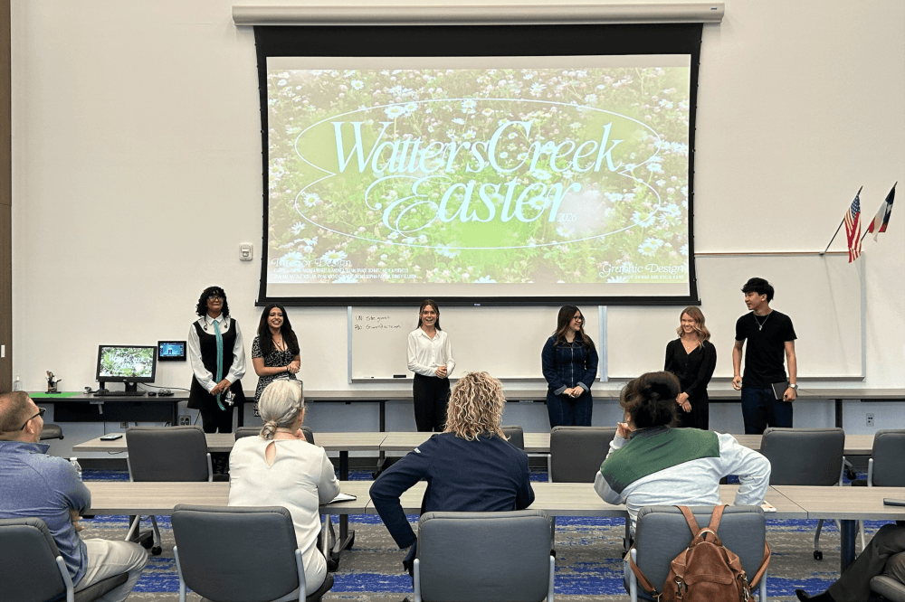 students presenting in front of panel