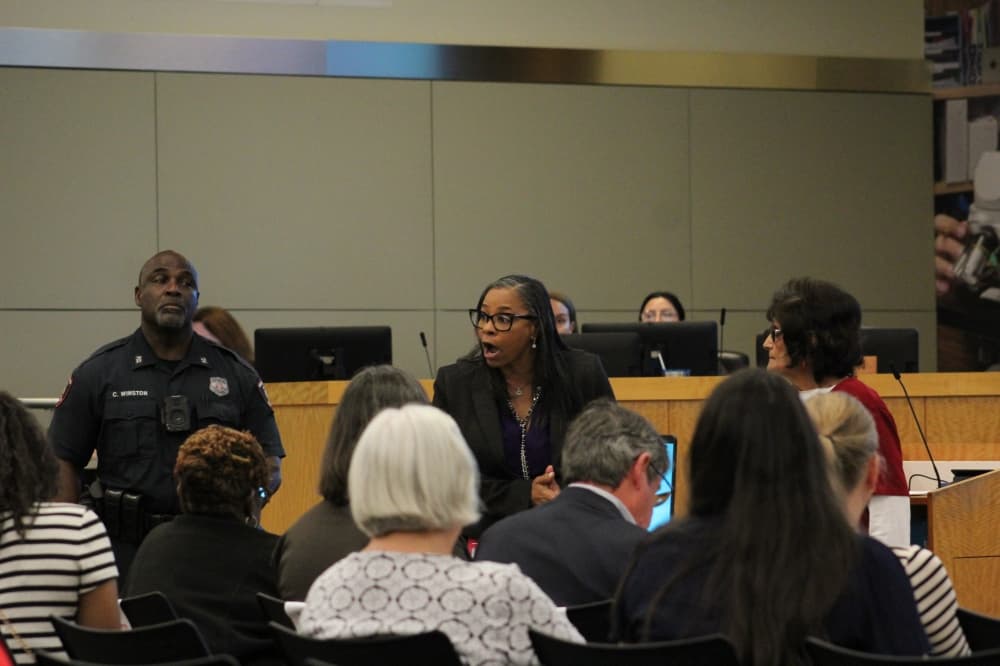 Houston ISD employee yelling at audience during Feb. 26 meeting.