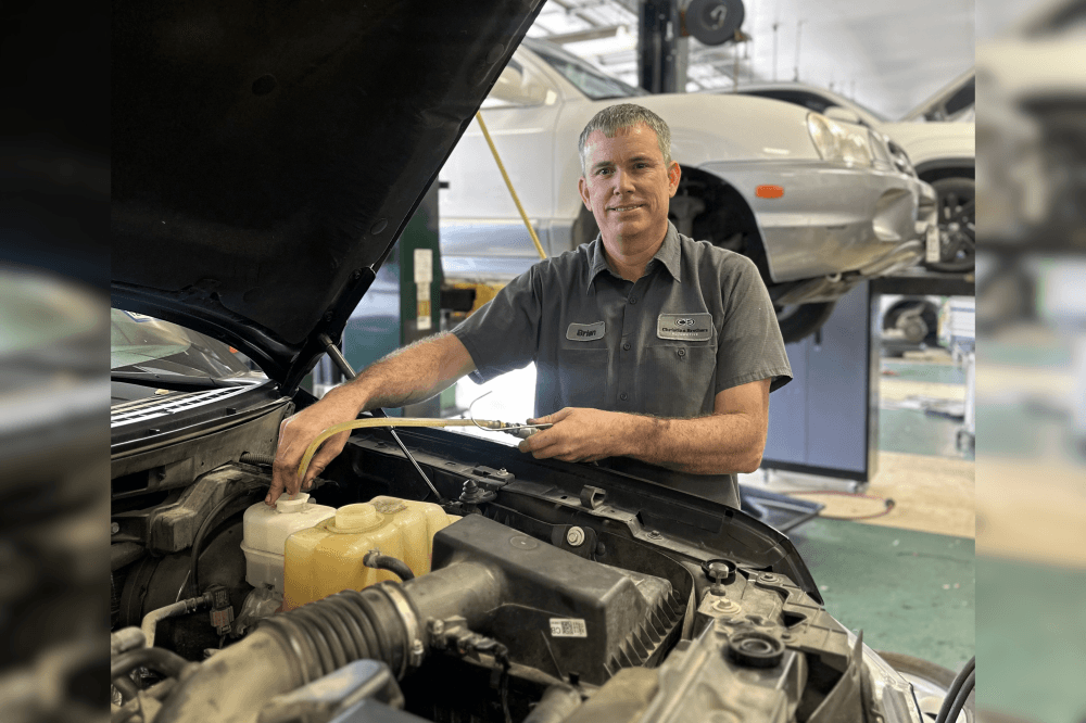 master certified technician doing car maintnence