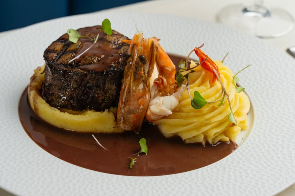The Filet Mignon comes with a 10-ounce steak in a mushroom glaze and is served with mashed potatoes. (Courtesy Acquario Italian Restaurant)