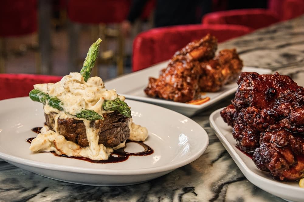 Menu items at Confessions include an 8-oz Filet Mignon Oscar Style, Spicy Peach Wings and Blueberry Wings. (Eric Taylor/Confessions)