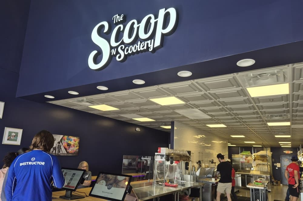 The interior of The Scoop N Scootery has its signature signage above the ordering area. (Patricia Ortiz/Community Impact)