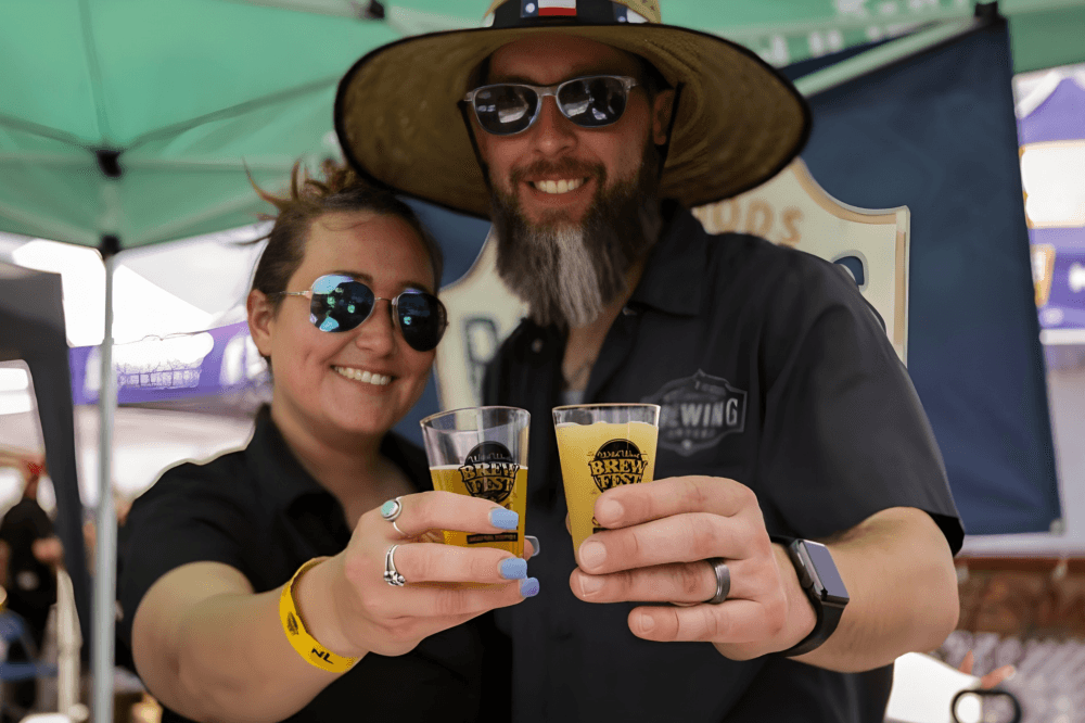 Large crowd enjoying the atmosphere at Wild West Brewfest in Katy, Texas, a popular Houston-area craft beer festival featuring hundreds of beers, live music, food vendors and community fundraising hosted by the Rotary Club of Katy at Typhoon Texas.
