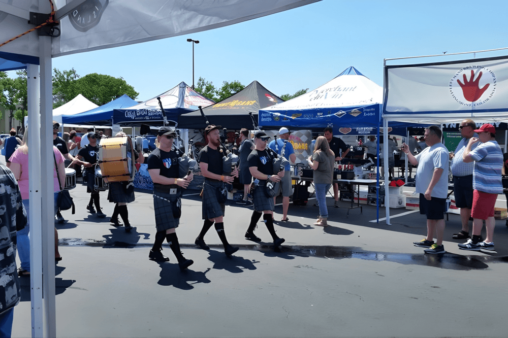 Rows of brewery tents and beer tasting stations at Wild West Brewfest in Katy, Texas, where visitors explore craft beers from regional and national breweries during the annual Houston-area charity beer festival.