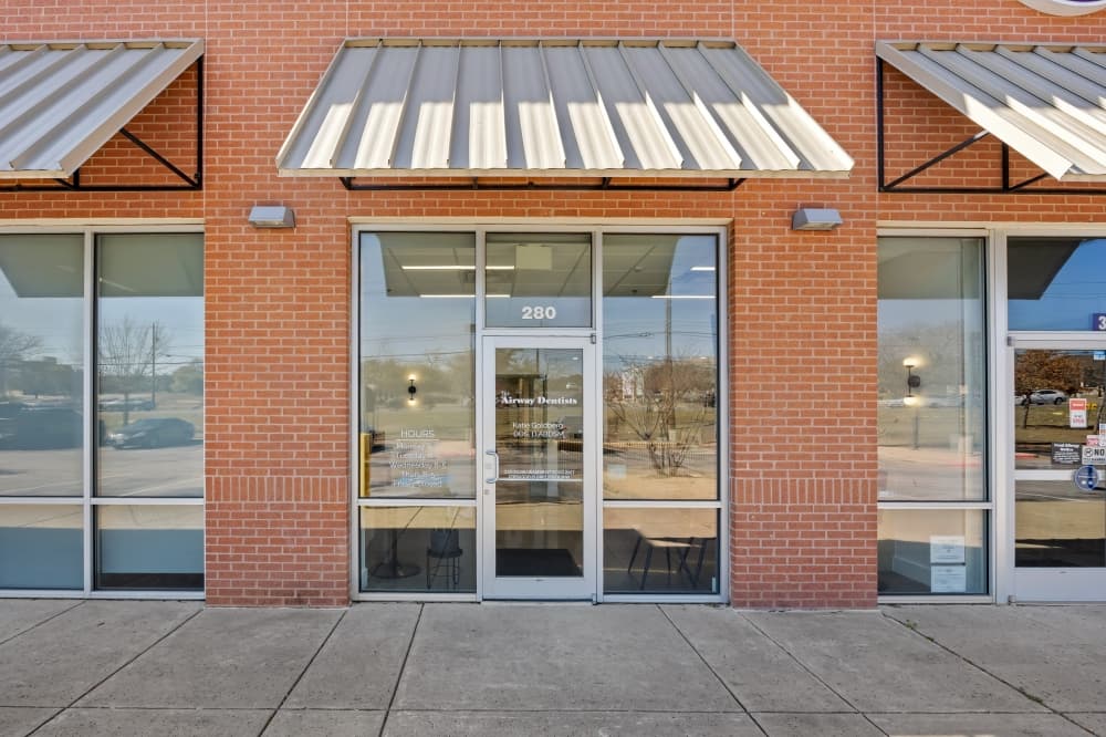 storefront with door text reading "The Airway Dentists"