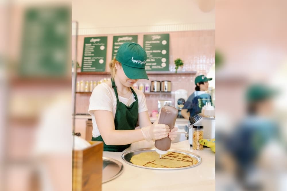 Woman making crepe