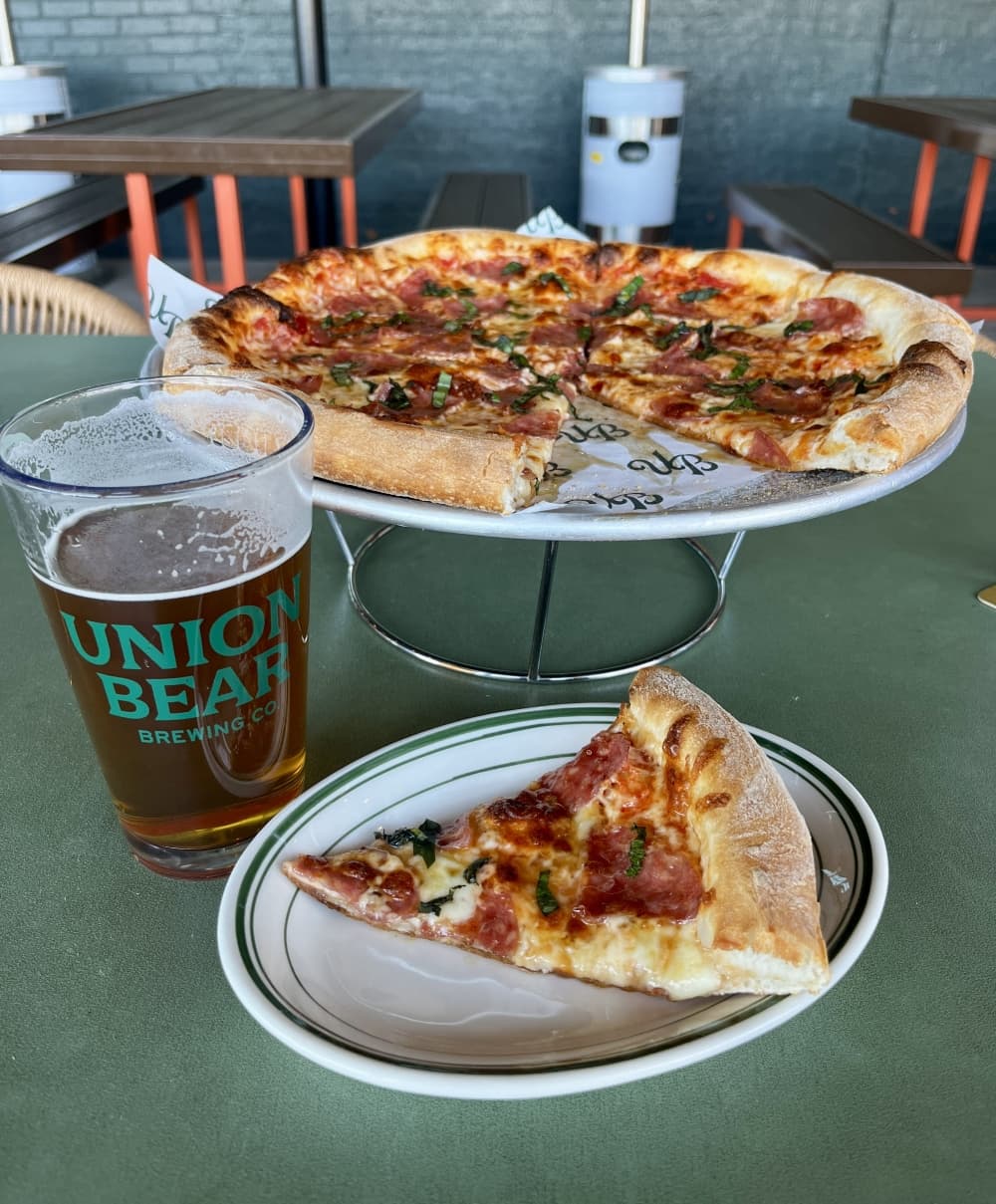 Union Bear Brewing Co.'s Denton location offers pizza, such as the OG Honey Pig, and other entrees, appetizers and a full bar menu. (Gabby Bailey/Community Impact)