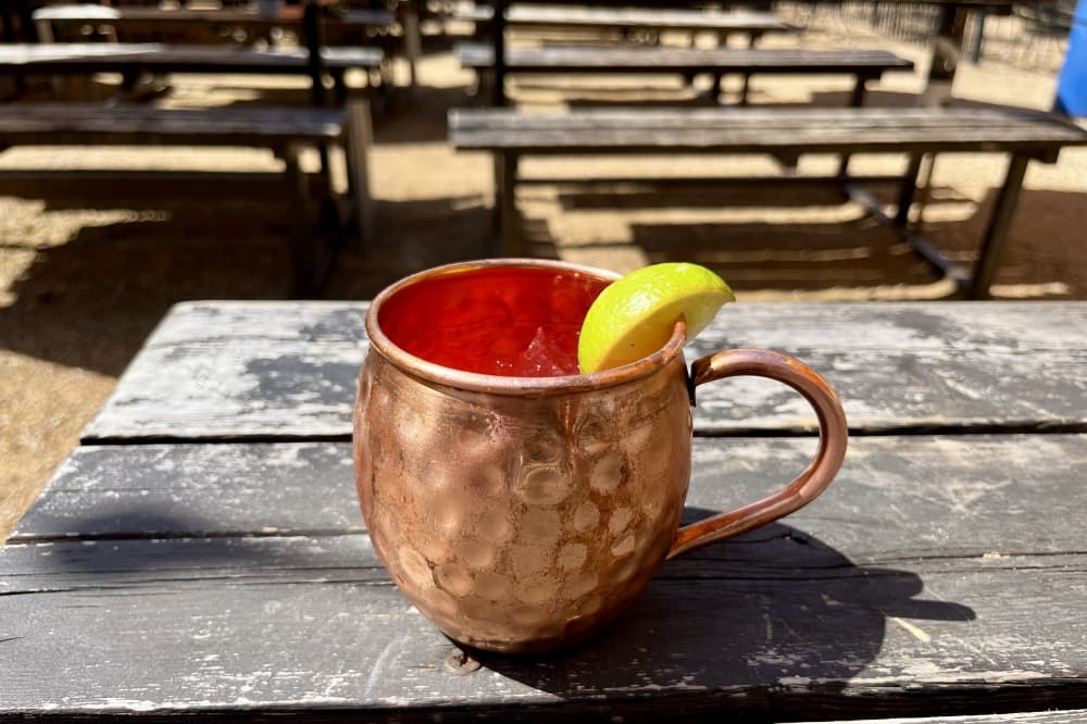 East Side has a full wall of beer taps and cocktails such as the Hibiscus Moscow Mule. (Gabby Bailey/Community Impact)