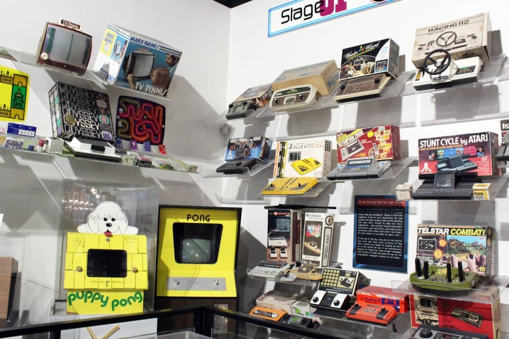 Various videogame prototypes displayed on a wall. 