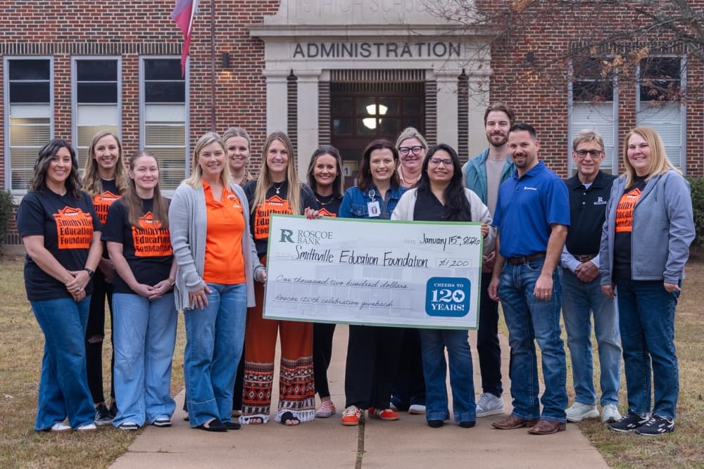 Smithville Education Foundation holding check