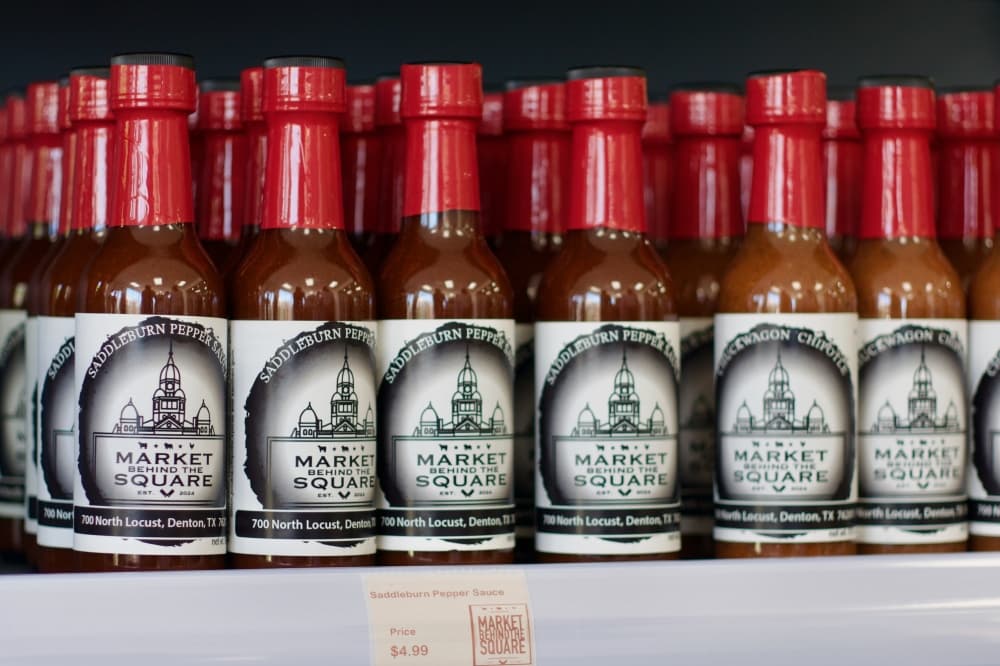 Market Behind the Square has house-made sauces for purchase in the store. (Adam Doe/Community Impact)