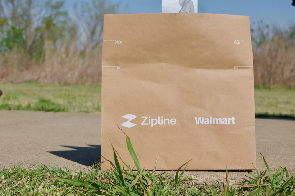 The deliveries are placed in a paper bag inside the tethered unit. At the moment, each drone can carry five pounds. (Adam Doe/Community Impact)