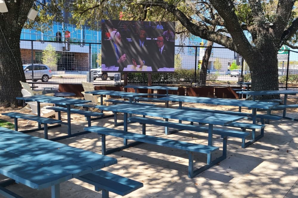 Walter's Tavern plays sports games outside on a 15-foot jumbotron
