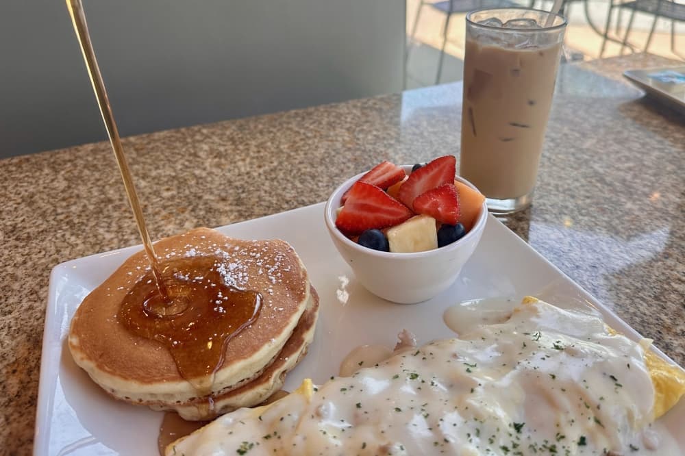 Pancakes, fruit and an omlet