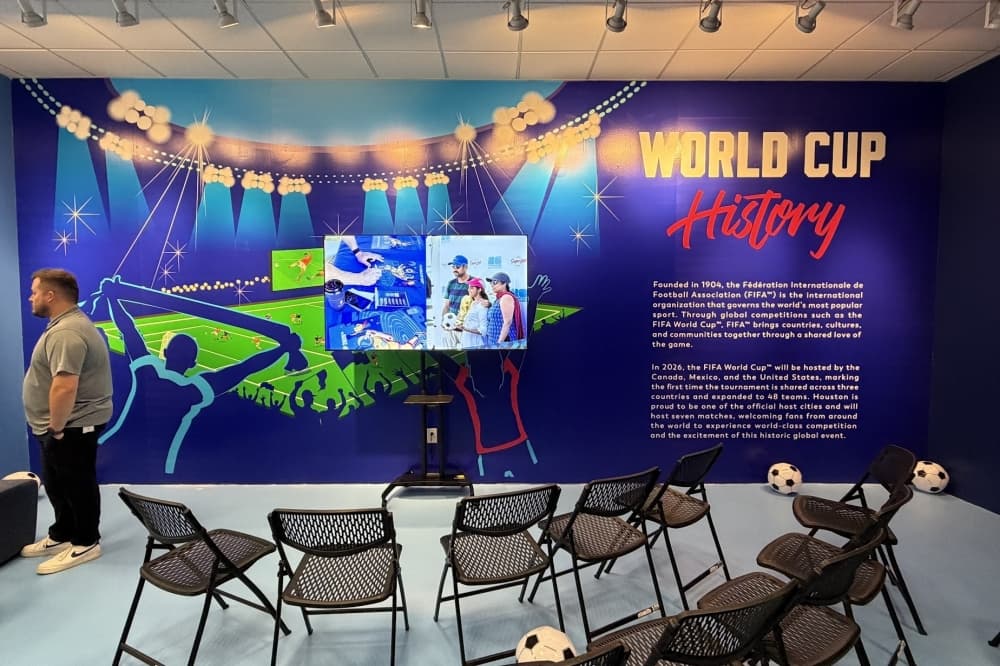 Austin Pennington, Sugar Land’s graphic design/multimedia coordinator, helped lead a team to make the center's walls come to life. (Brad Dountz/Community Impact)