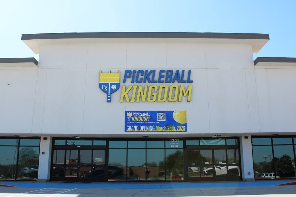 Exterior of a strip center featuring Pickleball Kingdom signage. 