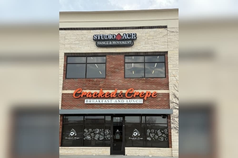 the exterior of a dance studio above another business