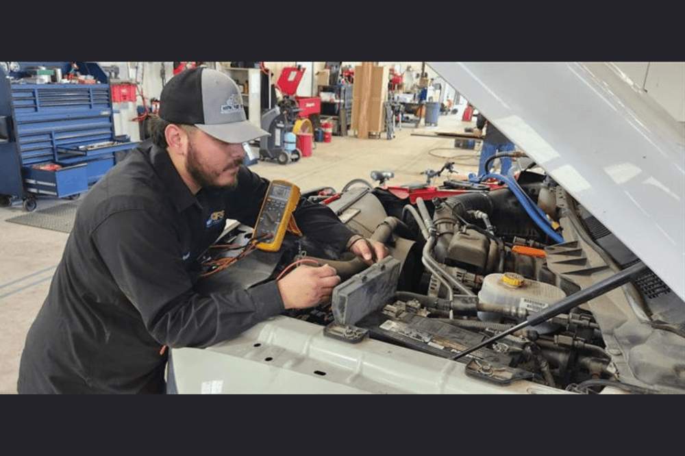 pflugerville mechanic working on car