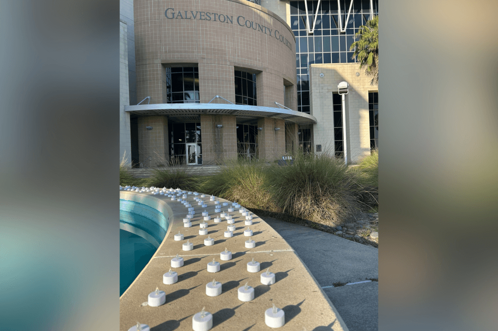 Community candlelight vigil honoring victims of child abuse and neglect during Child Abuse Awareness Month in Galveston County