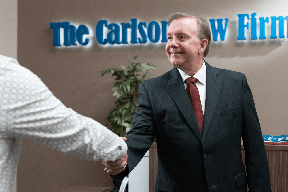 Attorney shaking client's hand