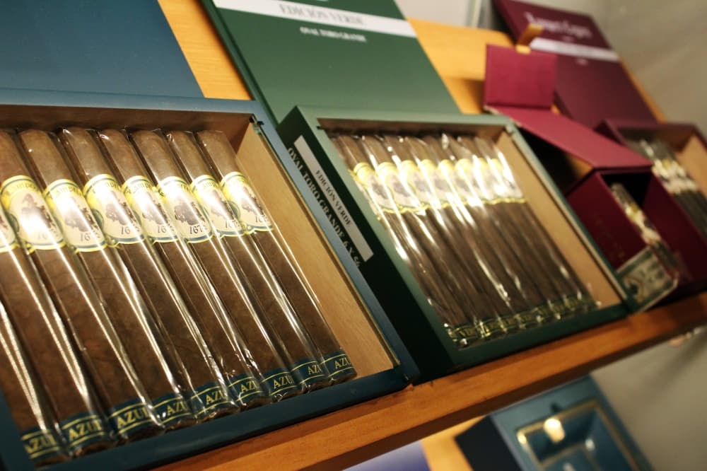 Boxes of cigars displayed in a humidor. 