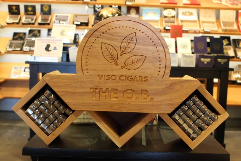 Cigars in a wooden case featuring Viso Cigars Original Brand signage. 