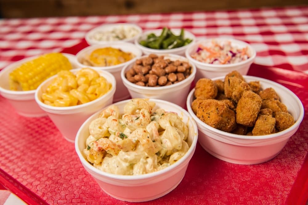 C&J Barbeque’s menu includes side dishes, such as ranch potatoes, pinto beans, macaroni and cheese, collard greens, and fried okra. (Courtesy C&J Barbeque)