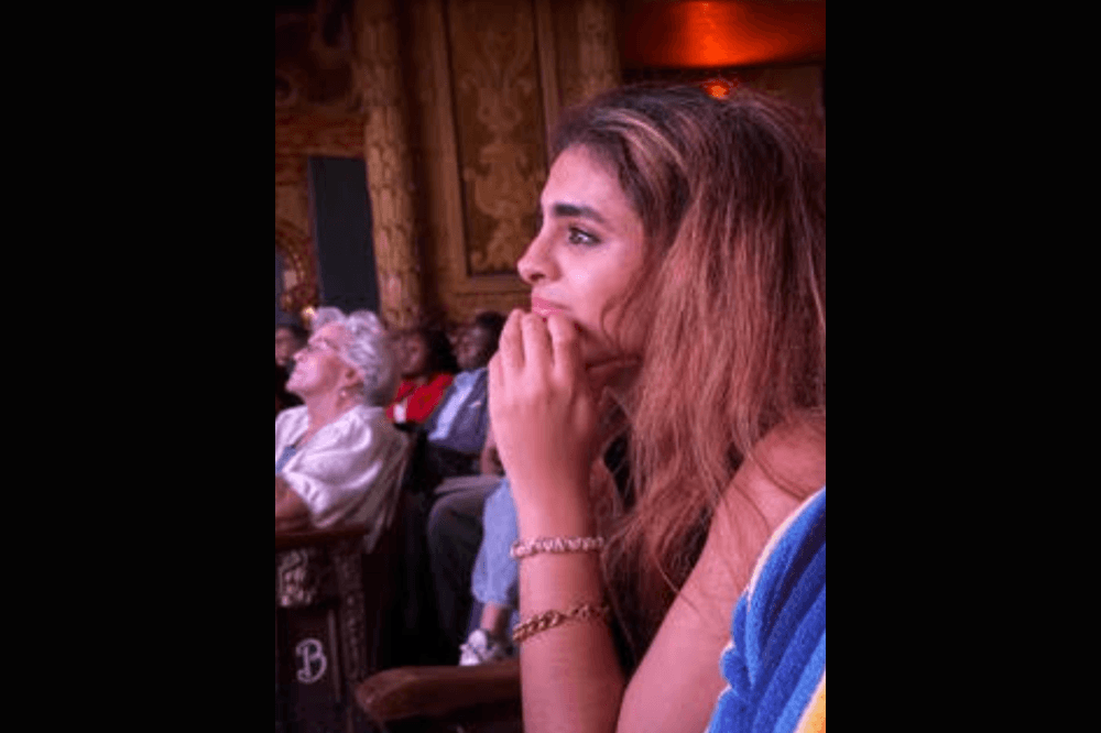 Woman watching film and crying