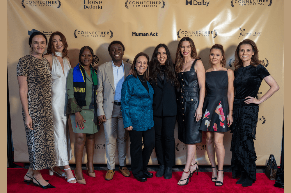 Film festival attendees and organizers on red carpet